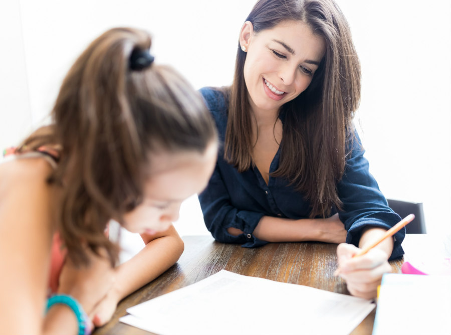 mother teaching child in homeschool
